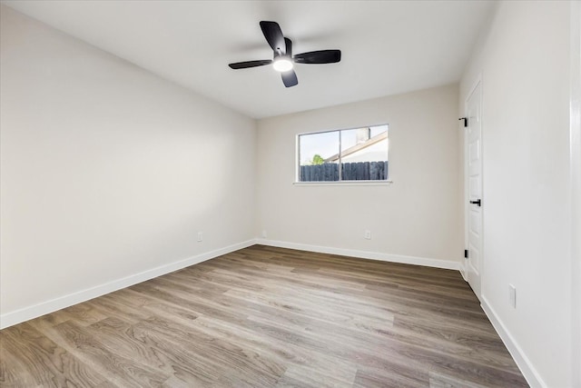 8902 Hendon Ln, Houston, TX 77036 - spare room featuring a ceiling fan, baseboards, and wood finished floors