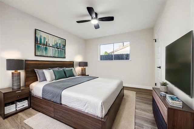 8902 Hendon Ln, Houston, TX 77036 - bedroom featuring wood finished floors, baseboards, and ceiling fan