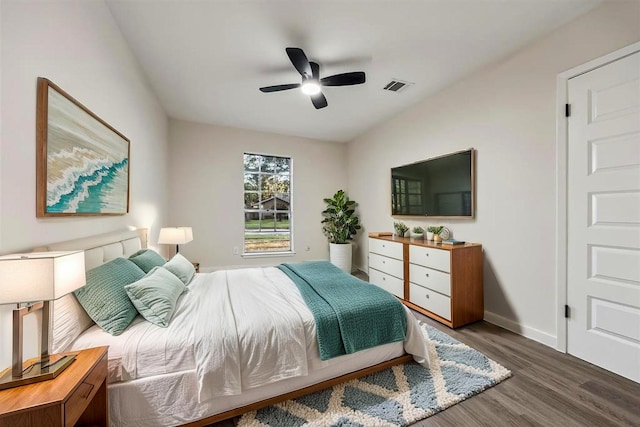 8902 Hendon Ln, Houston, TX 77036 - bedroom with wood finished floors, baseboards, and ceiling fan