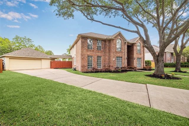 1703 Lakewinds Dr, Missouri City, TX 77459 - colonial home with brick siding, driveway, and an attached garage