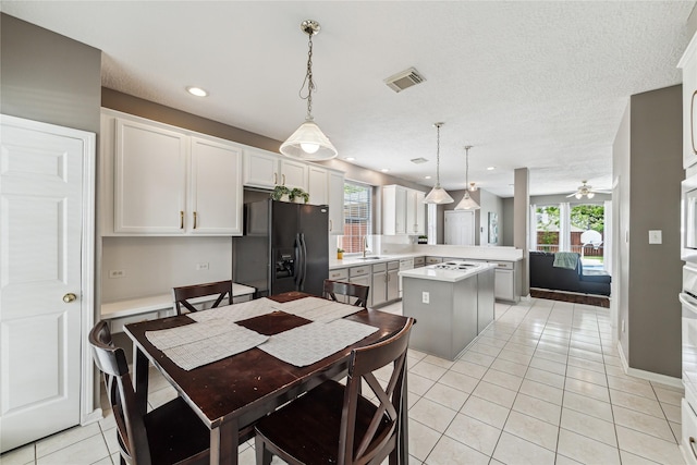 1703 Lakewinds Dr, Missouri City, TX 77459 - dining area featuring ceiling fan, light tile patterned floors, and recessed lighting