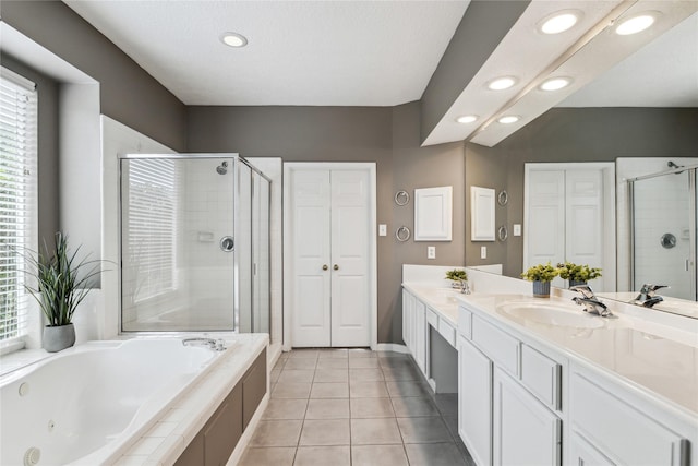 1703 Lakewinds Dr, Missouri City, TX 77459 - bathroom featuring a stall shower, recessed lighting, a whirlpool tub, double vanity, and tile patterned floors
