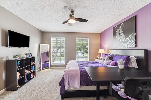 1703 Lakewinds Dr, Missouri City, TX 77459 - carpeted bedroom featuring baseboards, a ceiling fan, and a textured ceiling