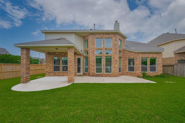 9968 Tallow Pointe Ln, Brookshire, TX 77423 - back of house with a chimney, a patio area, and brick siding