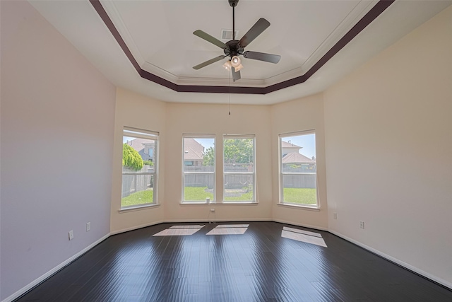 9968 Tallow Pointe Ln, Brookshire, TX 77423 - spare room featuring ornamental molding, a raised ceiling, dark wood-type flooring, baseboards, and a ceiling fan