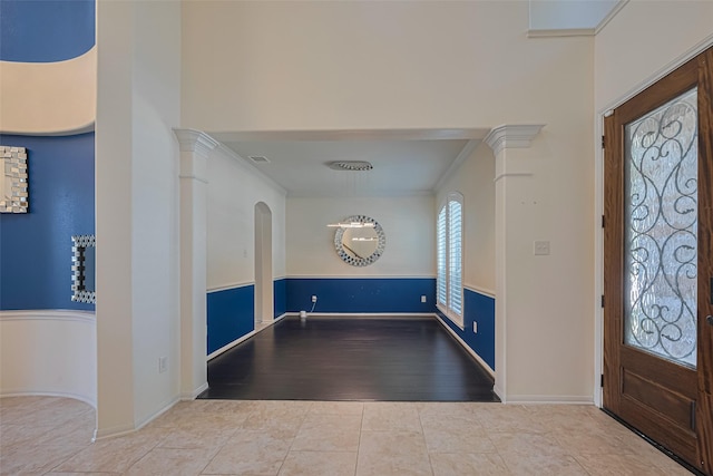 9968 Tallow Pointe Ln, Brookshire, TX 77423 - tiled entrance foyer featuring baseboards, arched walkways, and crown molding