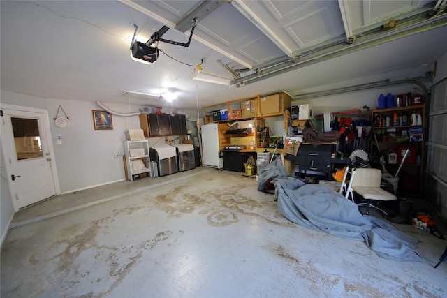 3726 Straightfork Dr, Houston, TX 77082 - garage with a garage door opener, separate washer and dryer, freestanding refrigerator, and baseboards