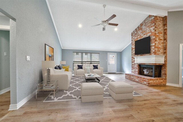 3726 Straightfork Dr, Houston, TX 77082 - living room with a ceiling fan, wood finished floors, a fireplace, baseboards, and a textured wall