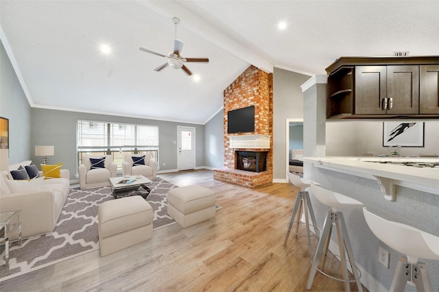 3726 Straightfork Dr, Houston, TX 77082 - living room with light wood-style flooring, a ceiling fan, baseboards, a brick fireplace, and ornamental molding
