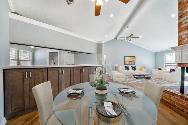 3726 Straightfork Dr, Houston, TX 77082 - dining room featuring ceiling fan, wood finished floors, a fireplace, and ornamental molding
