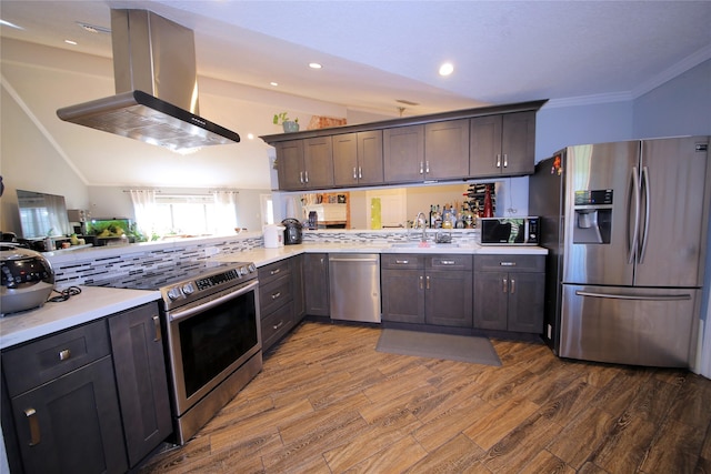 3726 Straightfork Dr, Houston, TX 77082 - kitchen with appliances with stainless steel finishes, island range hood, a sink, vaulted ceiling, and dark wood finished floors
