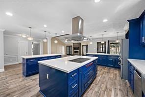 15418 Windy Cove Dr, Houston, TX 77095 - kitchen with blue cabinets, a kitchen island, black electric cooktop, light wood finished floors, and recessed lighting