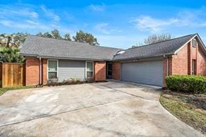 15418 Windy Cove Dr, Houston, TX 77095 - ranch-style house featuring a garage, concrete driveway, and brick siding