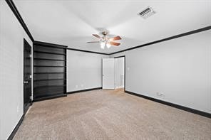 15418 Windy Cove Dr, Houston, TX 77095 - unfurnished room with crown molding, carpet flooring, baseboards, and a ceiling fan
