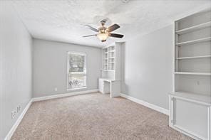 15418 Windy Cove Dr, Houston, TX 77095 - unfurnished bedroom featuring baseboards, carpet floors, and a ceiling fan