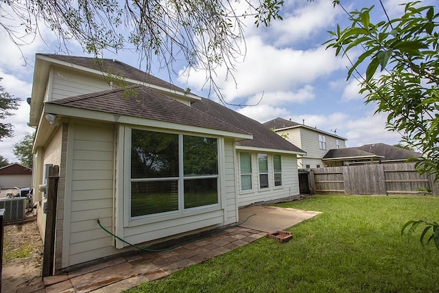 21926 Crestworth Ln, Katy, TX 77449 - back of property with a patio area and roof with shingles