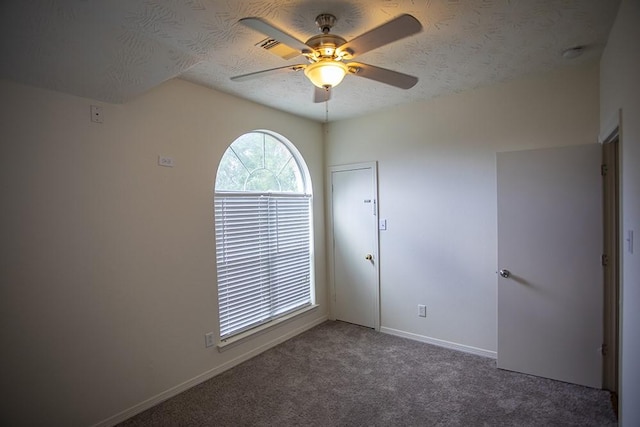 21926 Crestworth Ln, Katy, TX 77449 - unfurnished room with ceiling fan, carpet flooring, a textured ceiling, and baseboards