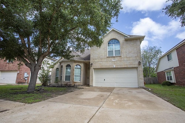 21926 Crestworth Ln, Katy, TX 77449 - traditional home with an attached garage, driveway, and brick siding