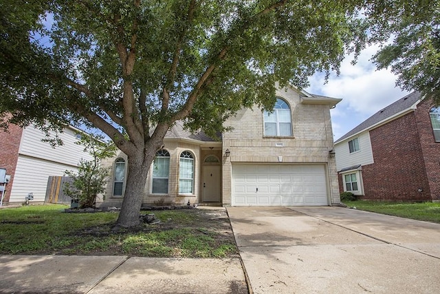 21926 Crestworth Ln, Katy, TX 77449 - traditional-style home featuring a garage, brick siding, and driveway