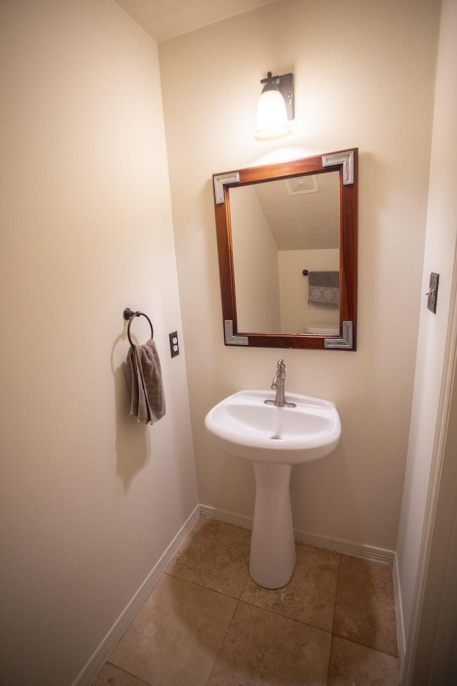 21926 Crestworth Ln, Katy, TX 77449 - bathroom with baseboards, tile patterned floors, and a sink