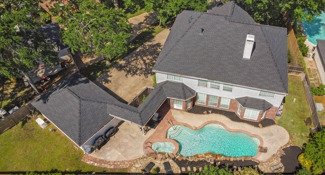 view of subject property featuring a pool area
