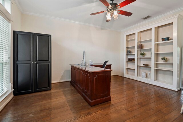 office area featuring ceiling fan, dark wood finished floors, healthy amount of natural light, crown molding, and baseboards