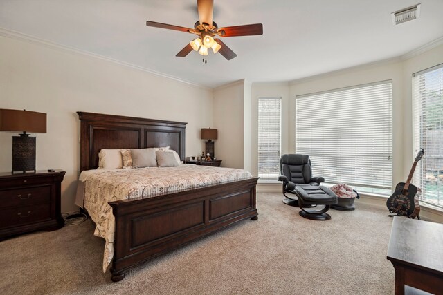bedroom with light carpet, ornamental molding, and ceiling fan