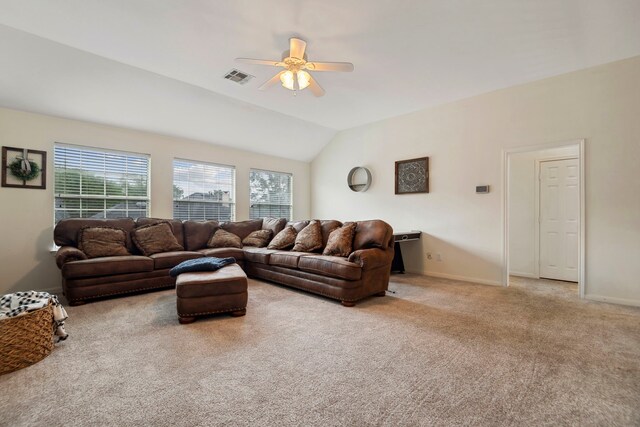 living room with ceiling fan, carpet, lofted ceiling, and baseboards