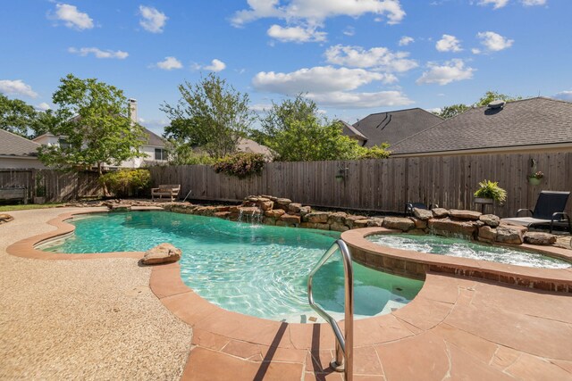 view of swimming pool featuring a fenced backyard, a patio area, and a pool with connected hot tub