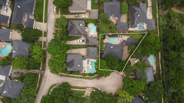 aerial view of residential area featuring a pool and property parcel outlined