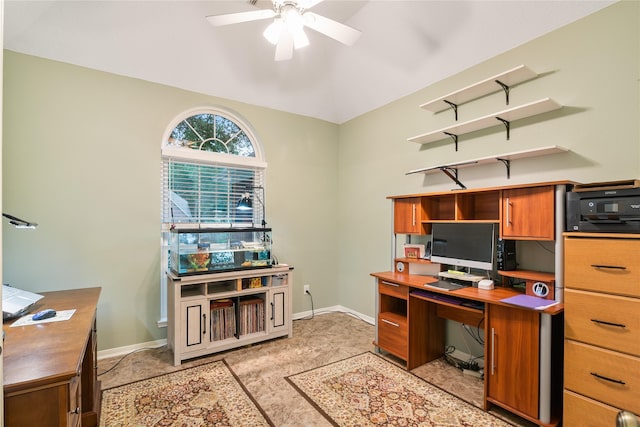 home office featuring ceiling fan, baseboards, and lofted ceiling