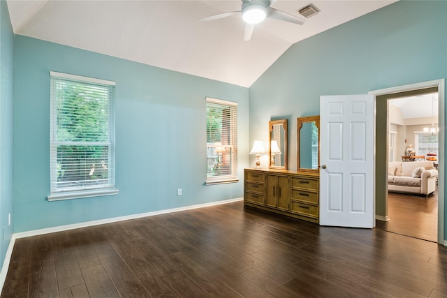 bedroom with lofted ceiling, dark wood-style floors, baseboards, and a chandelier