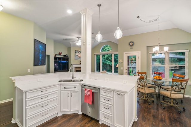 kitchen with stainless steel dishwasher, lofted ceiling, a sink, dark wood-type flooring, and light countertops