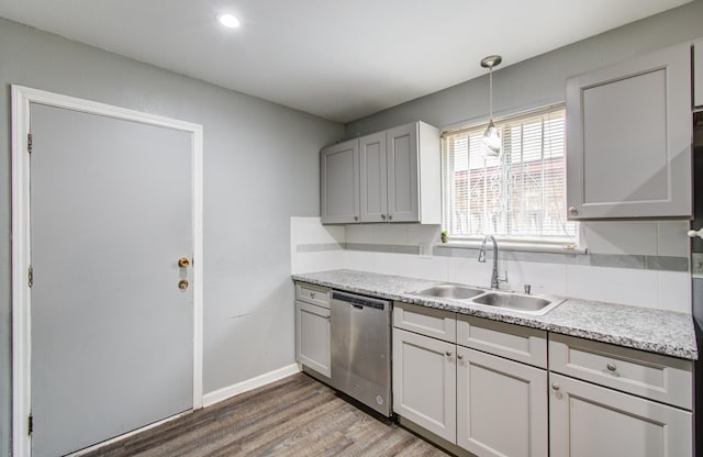 9502 Kell Cir, Houston, TX 77040 - kitchen with dishwasher, a sink, light wood-style flooring, light countertops, and decorative backsplash