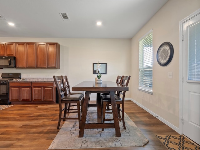 14506 Sweet Cherry Dr, Houston, TX 77069 - dining space with dark wood finished floors, recessed lighting, and baseboards