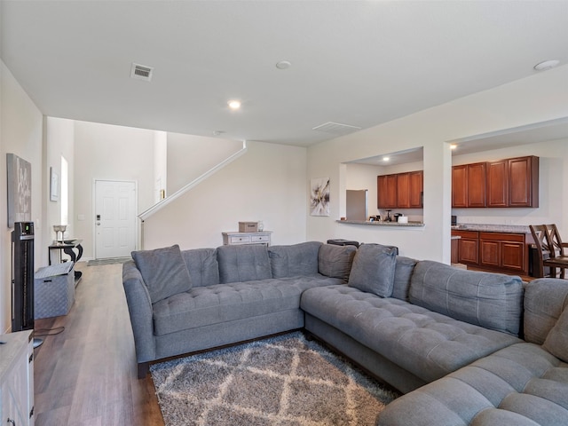 14506 Sweet Cherry Dr, Houston, TX 77069 - living area with wood finished floors, stairs, and recessed lighting