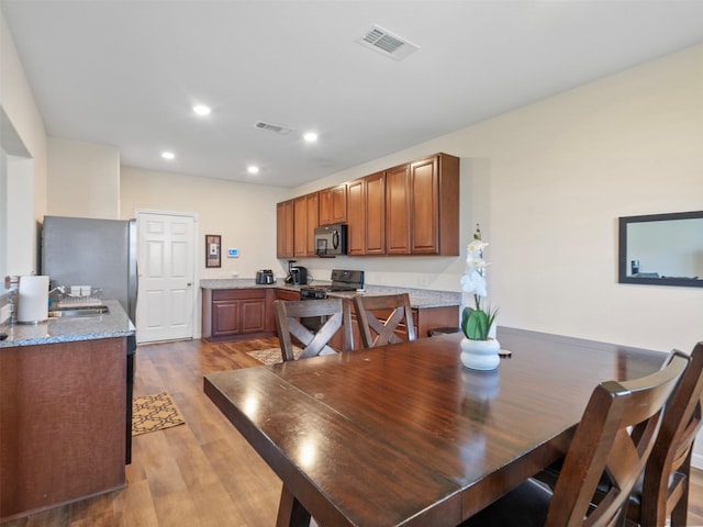 14506 Sweet Cherry Dr, Houston, TX 77069 - dining room with light wood-type flooring and recessed lighting