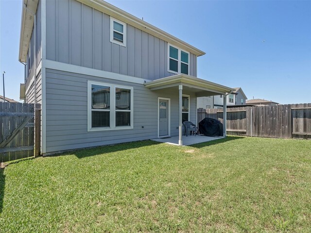14506 Sweet Cherry Dr, Houston, TX 77069 - back of property with board and batten siding and a patio area