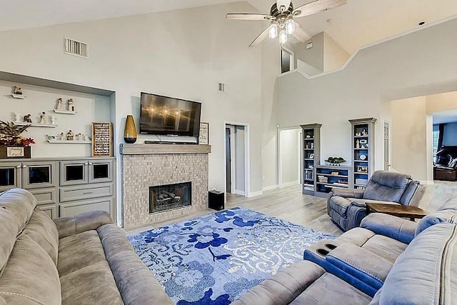 15538 Pine Valley Trl, Cypress, TX 77433 - living room with high vaulted ceiling, ceiling fan, a brick fireplace, wood finished floors, and baseboards