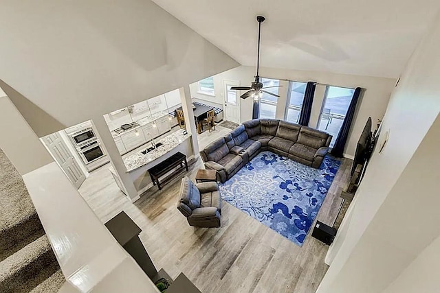 15538 Pine Valley Trl, Cypress, TX 77433 - living room with wood finished floors, a ceiling fan, and lofted ceiling