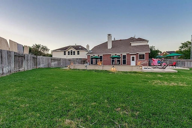 15538 Pine Valley Trl, Cypress, TX 77433 - back of property with a patio area, a chimney, and brick siding