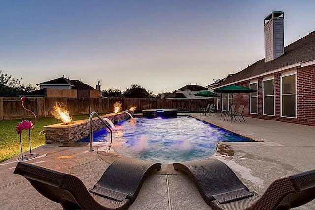 15538 Pine Valley Trl, Cypress, TX 77433 - view of pool featuring a fire pit, a fenced backyard, a patio area, and a pool with connected hot tub