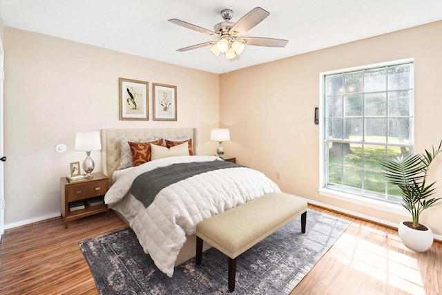 11802 Hamblin Rd, Cypress, TX 77429 - bedroom featuring baseboards, wood finished floors, and ceiling fan