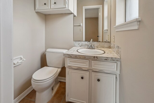 11802 Hamblin Rd, Cypress, TX 77429 - bathroom with toilet, vanity, tile patterned floors, and baseboards