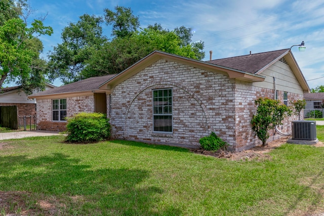 11802 Hamblin Rd, Cypress, TX 77429 - ranch-style house featuring central air condition unit, brick siding, and roof with shingles