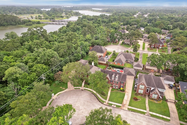 aerial perspective of suburban area with a large body of water