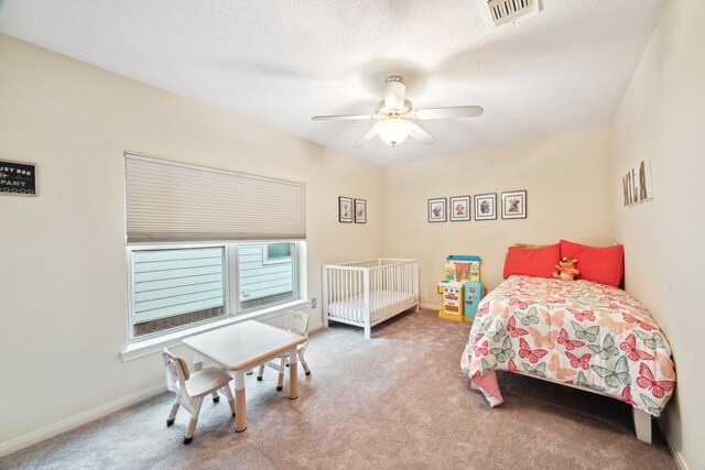 bedroom featuring carpet, baseboards, and ceiling fan