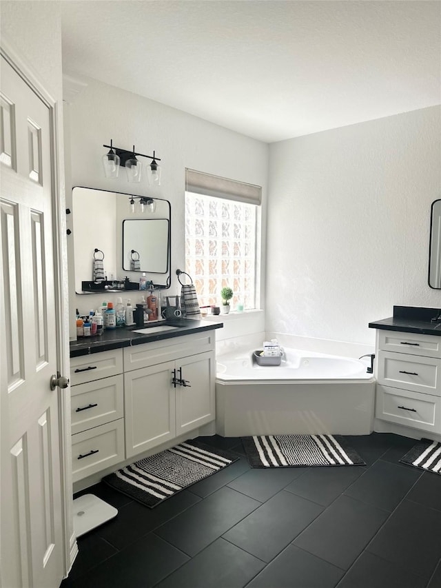 3522 Kent Knl, Missouri City, TX 77459 - bathroom featuring vanity, a garden tub, and tile patterned floors