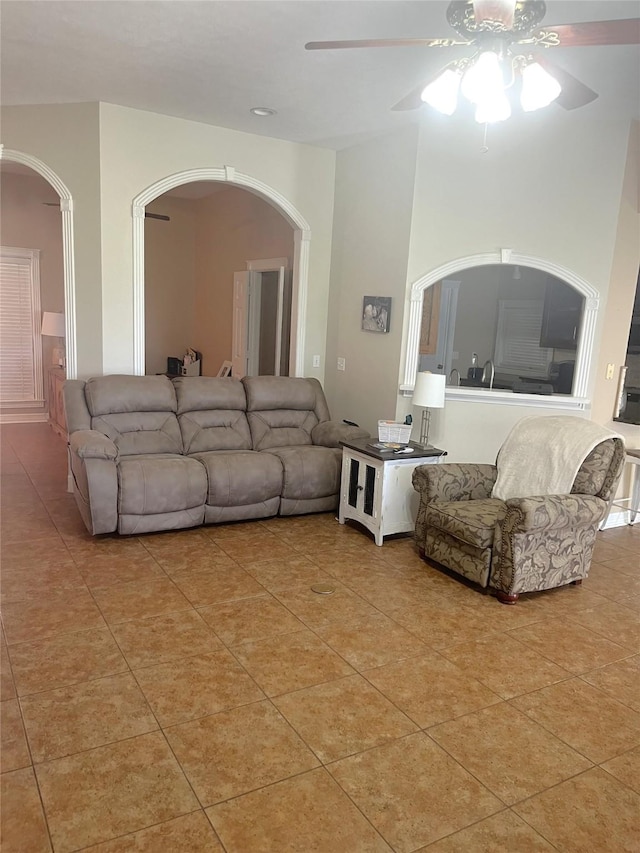 202 Golfview Dr, Normangee, TX 77871 - living room with arched walkways, a ceiling fan, and light tile patterned floors