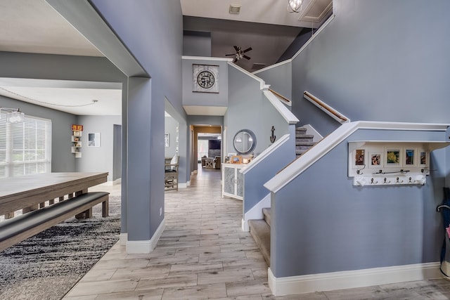 17611 Wind Mist Ln, Cypress, TX 77433 - entrance foyer featuring ceiling fan, stairs, wood finished floors, and baseboards